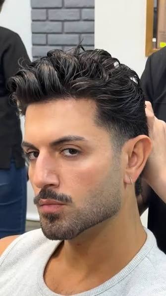 Heavy stubble beard style with a defined moustache