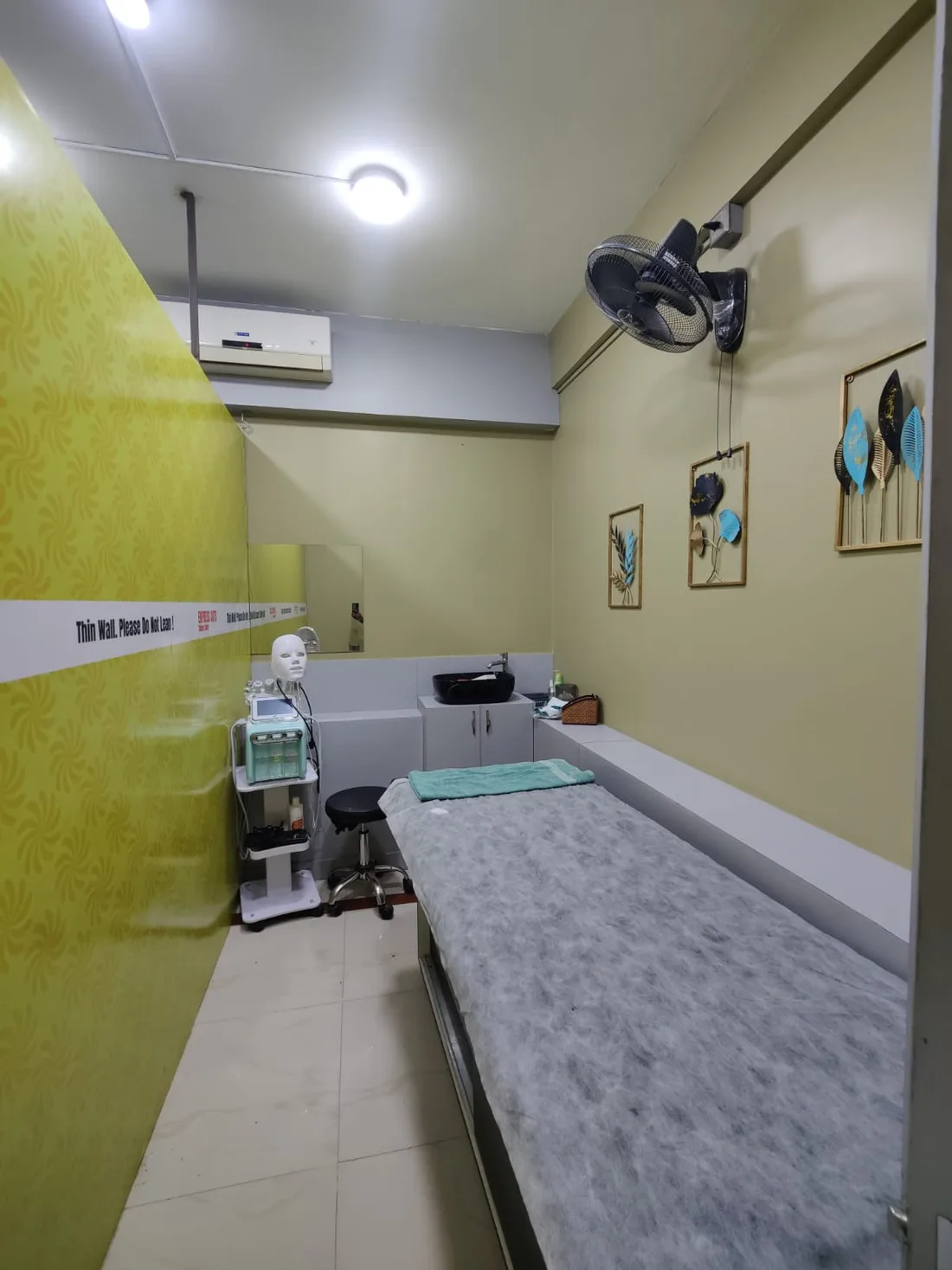 Facial and skin treatment room at Express Cuts Men's Salon in KR Puram