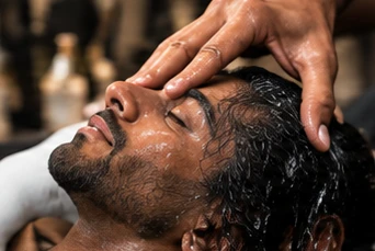 Relaxing scalp massage during a men's hair spa